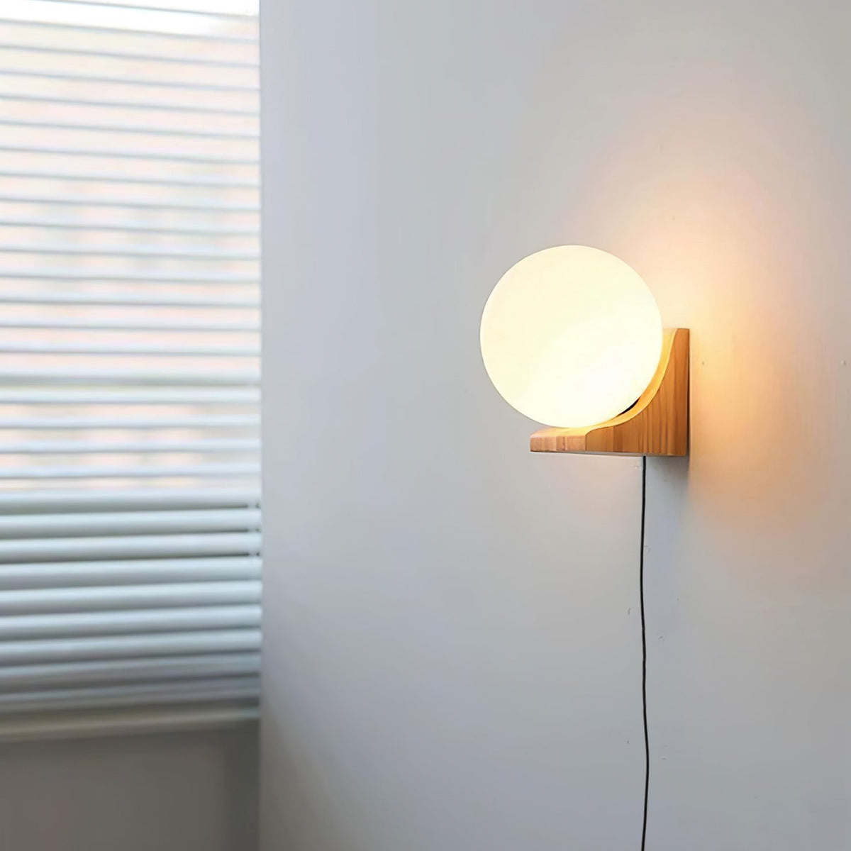 Evelyn Orb Plug-in Wall Sconce in Natural Oak and Dark Walnut