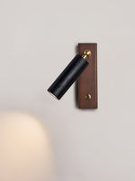 Event Horizon Adjustable Wall Sconce in Black Travertine and Brass