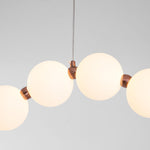 Ezrah Modern Linear LED Pendant Light – Frosted Glass Orbs
