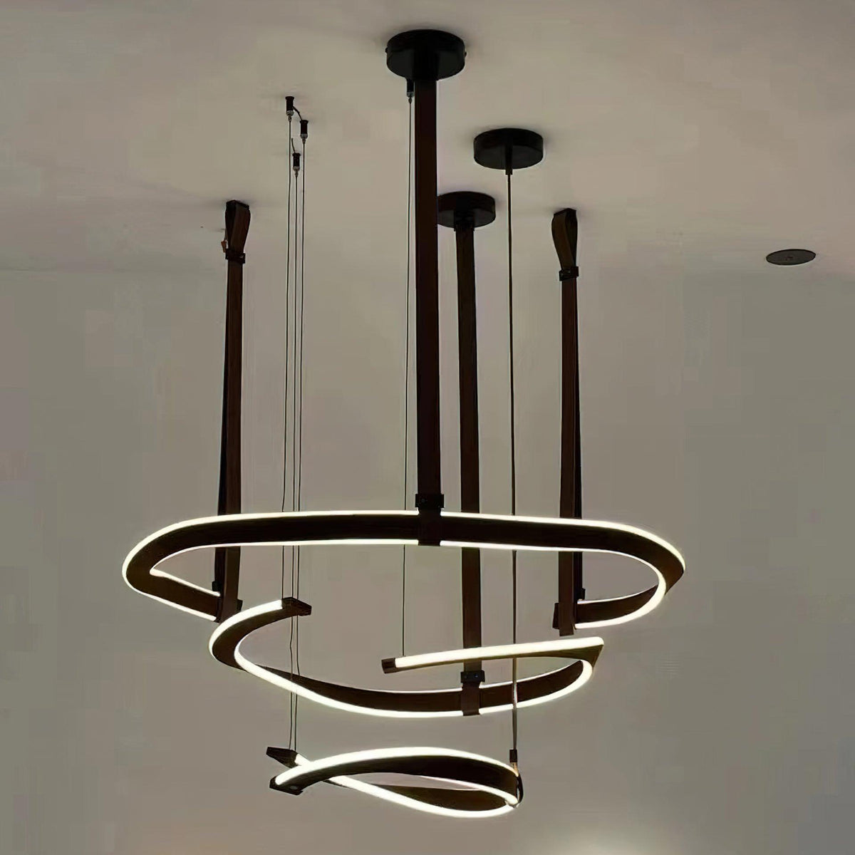 Finopi Linear LED Chandelier with Twisted Metal Rings and Leather Accents