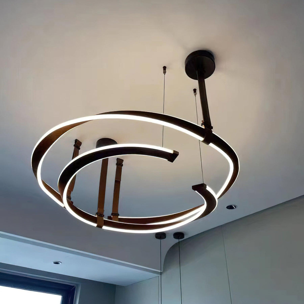 Finopi Linear LED Chandelier with Twisted Metal Rings and Leather Accents