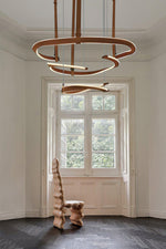 Finopi Linear LED Chandelier with Twisted Metal Rings and Leather Accents