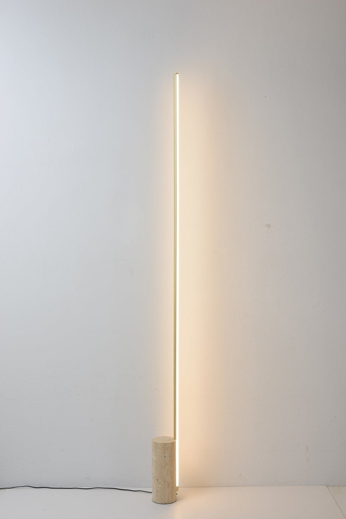 Linear LED Floor Lamp with Travertine Base for Modern Interiors
