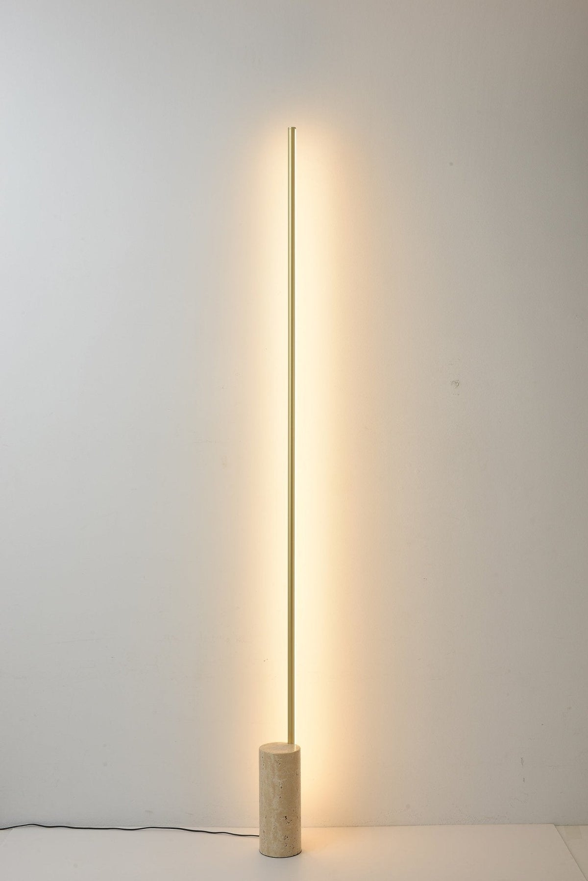 Linear LED Floor Lamp with Travertine Base for Modern Interiors