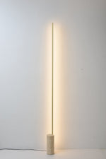 Linear LED Floor Lamp with Travertine Base for Modern Interiors