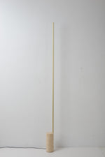 Linear LED Floor Lamp with Travertine Base for Modern Interiors