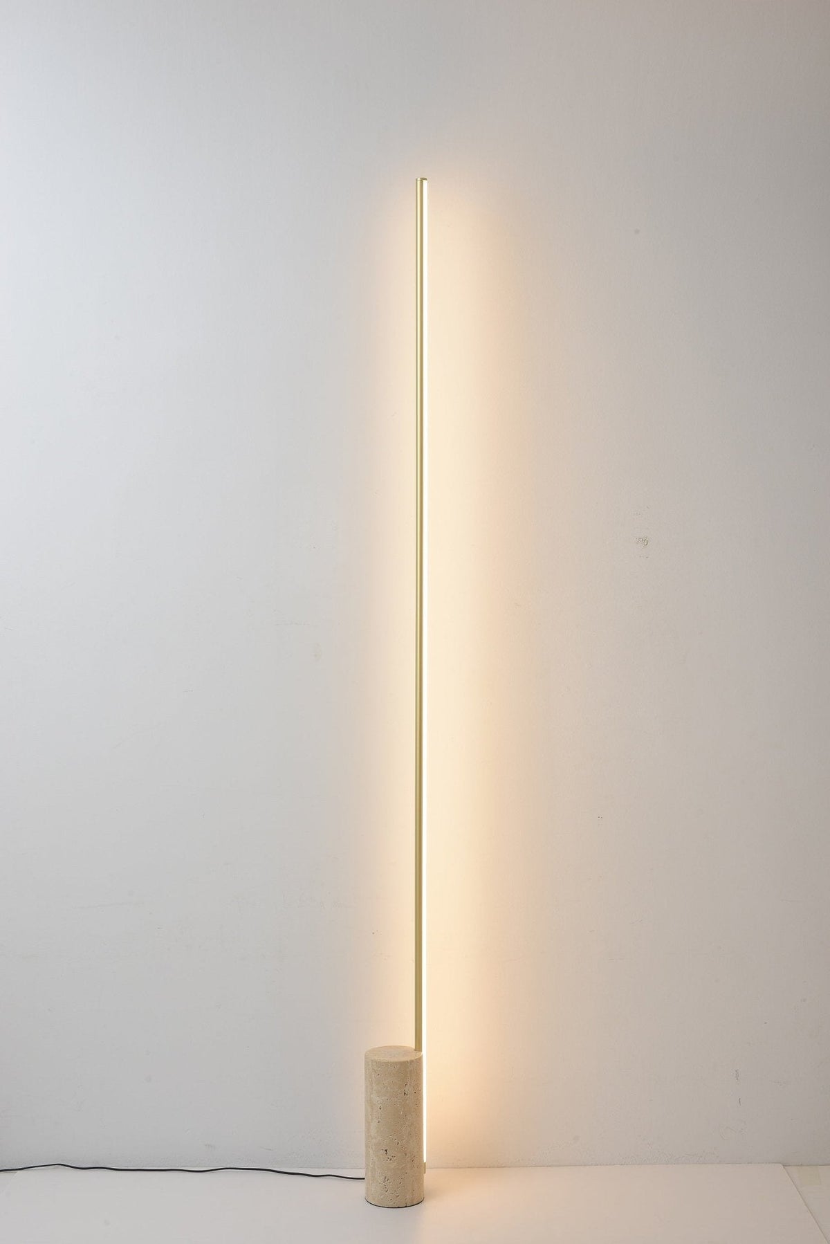 Linear LED Floor Lamp with Travertine Base for Modern Interiors