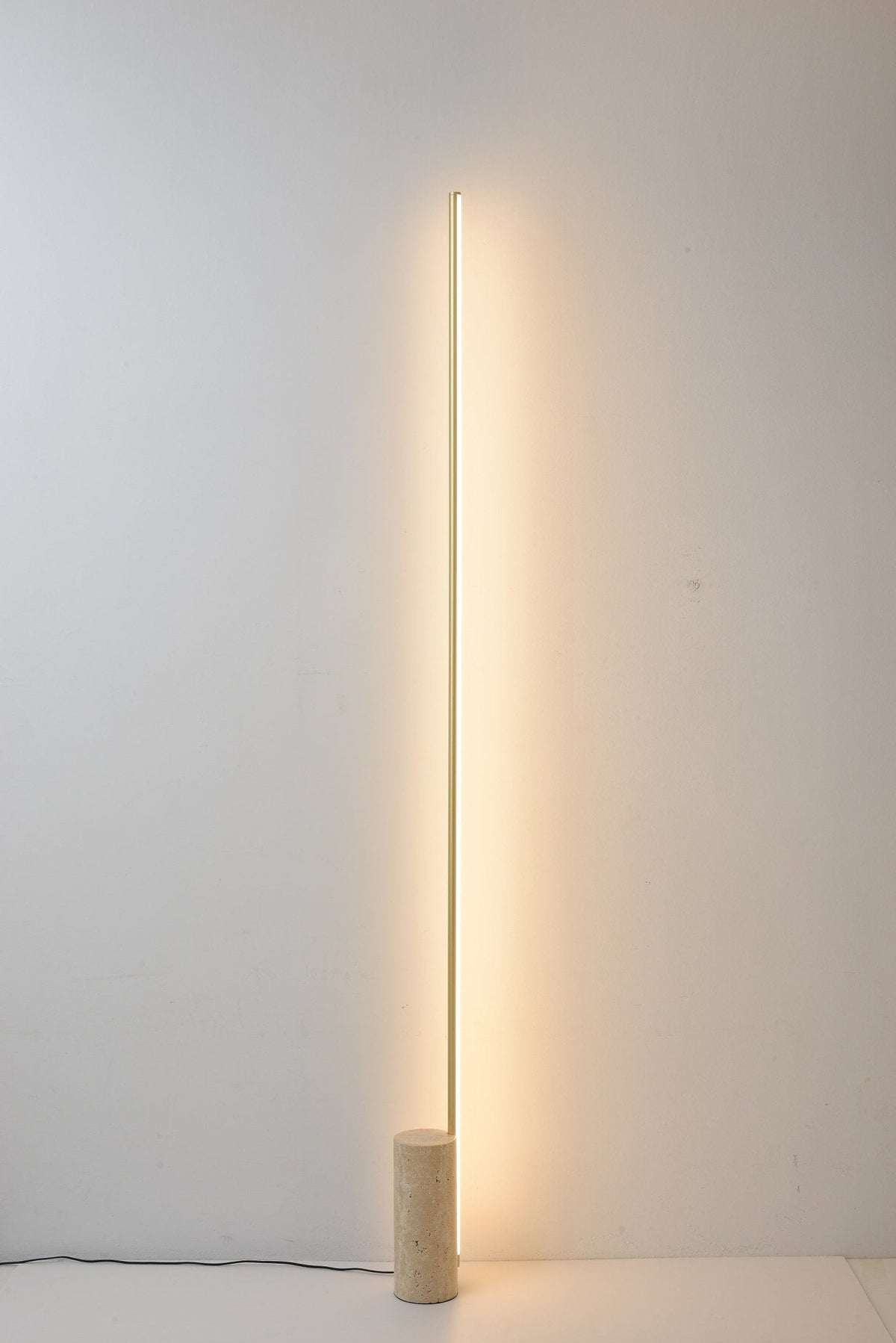Linear LED Floor Lamp with Travertine Base for Modern Interiors