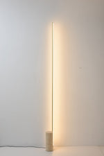 Linear LED Floor Lamp with Travertine Base for Modern Interiors