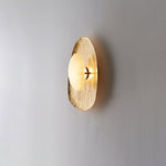 Aurea Alabaster Wall Sconce in Hand-Hammered Brass