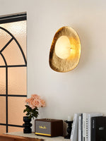 Aurea Alabaster Wall Sconce in Hand-Hammered Brass