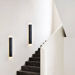 Kaedran Black Travertine LED Wall Sconce with Halo Backlighting