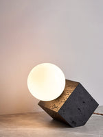 Kryden Sculptural Table Lamp in Black Travertine with Glass Globe