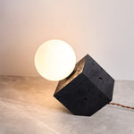 Kryden Sculptural Table Lamp in Black Travertine with Glass Globe
