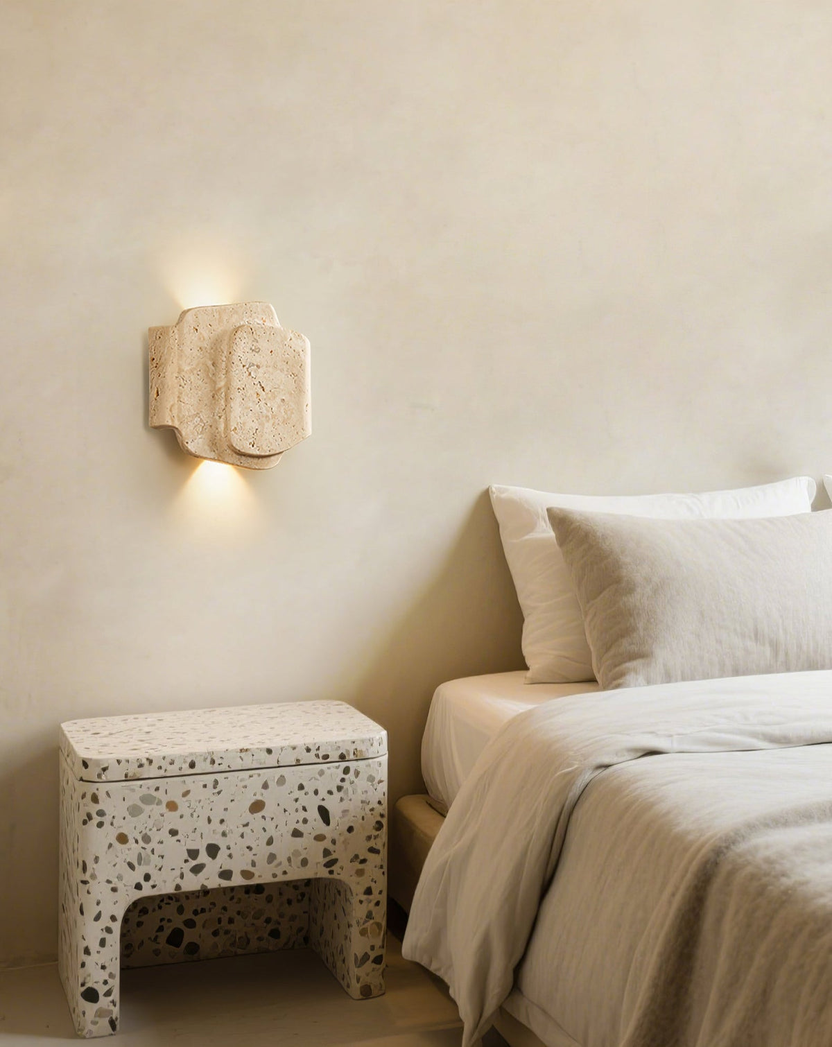 Layered Travertine Wall Sconce with Warm Ambient Glow