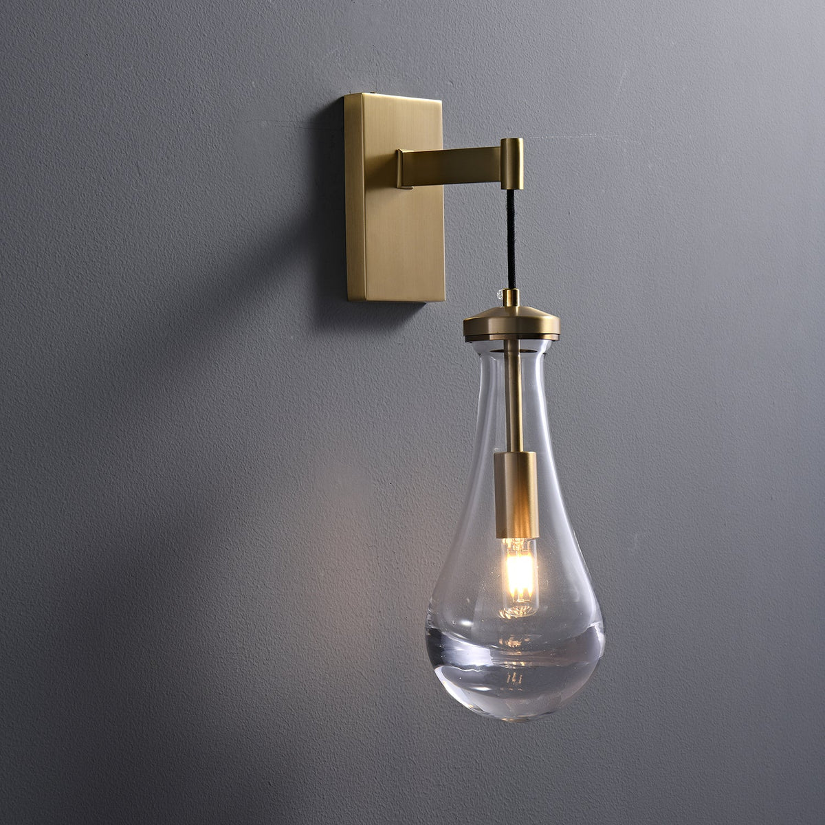 Leontine Brass Glass Teardrop Wall Sconce for Modern Interiors