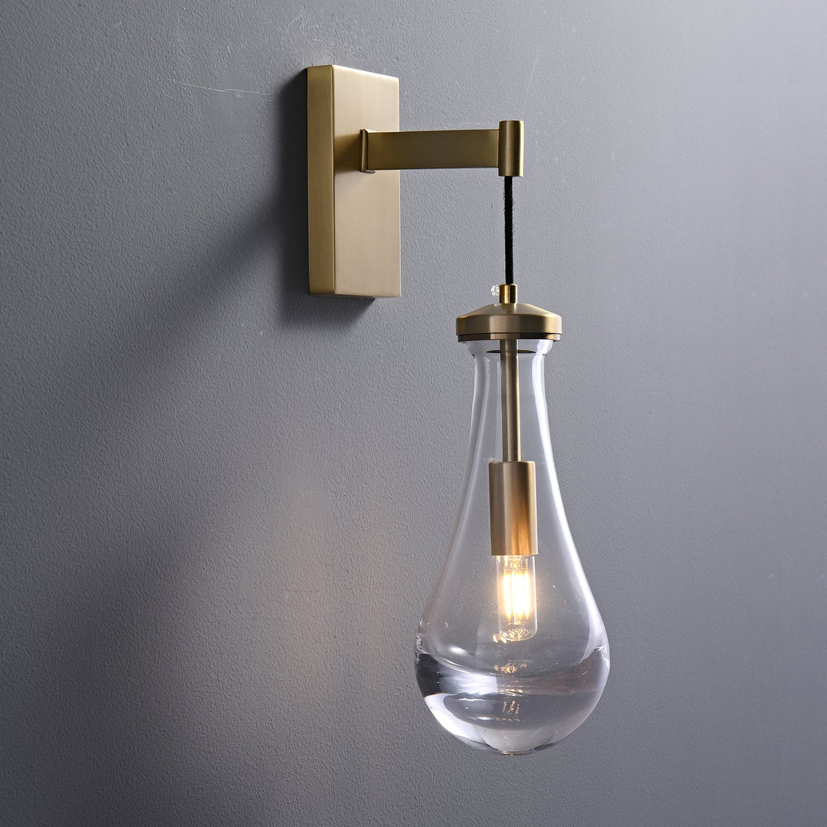 Leontine Brass Glass Teardrop Wall Sconce for Modern Interiors