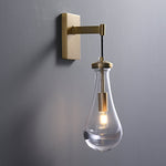 Leontine Brass Glass Teardrop Wall Sconce for Modern Interiors