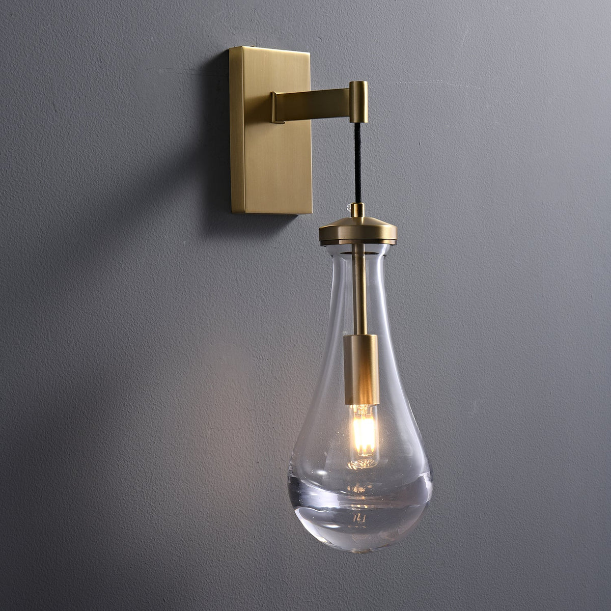 Leontine Brass Glass Teardrop Wall Sconce for Modern Interiors