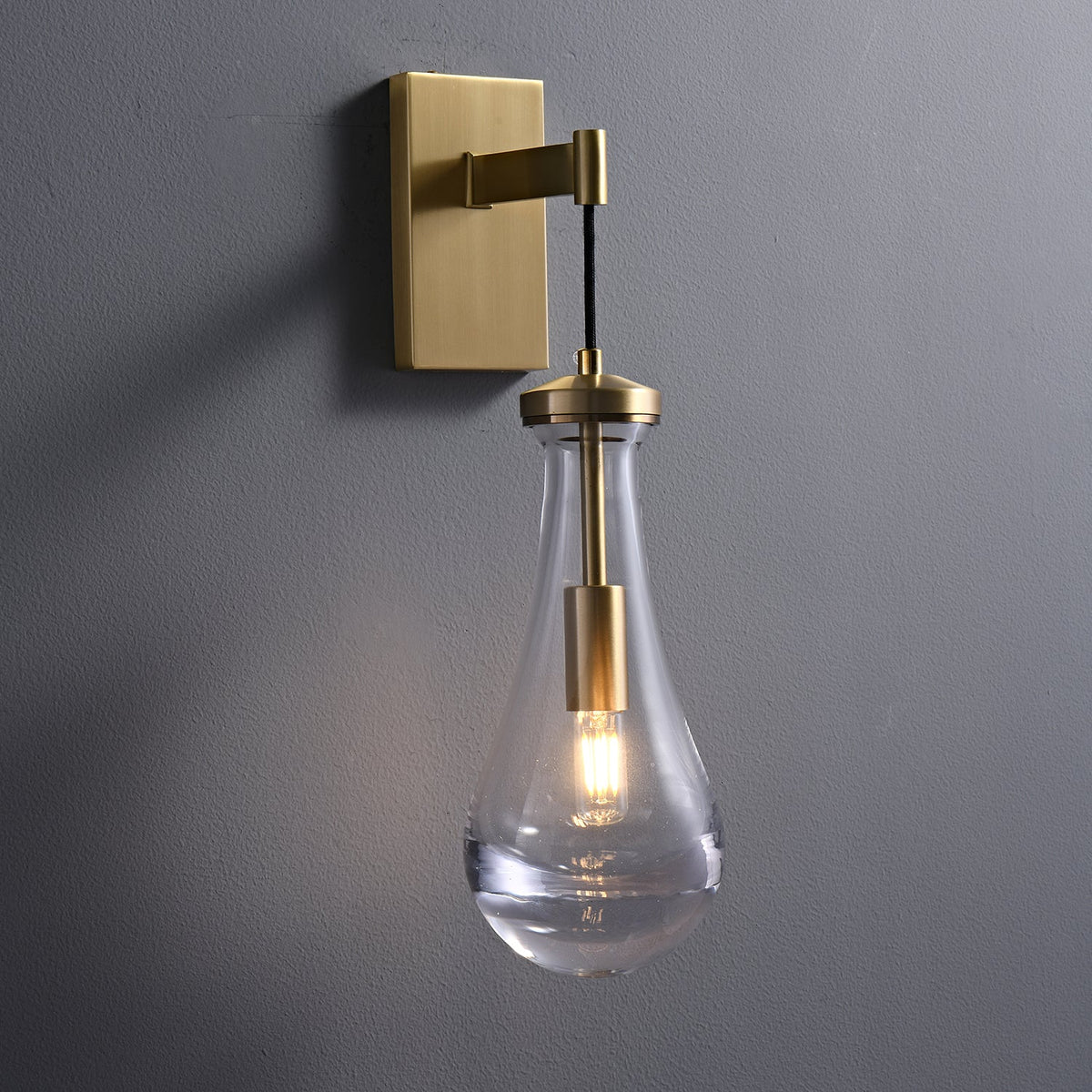Leontine Brass Glass Teardrop Wall Sconce for Modern Interiors