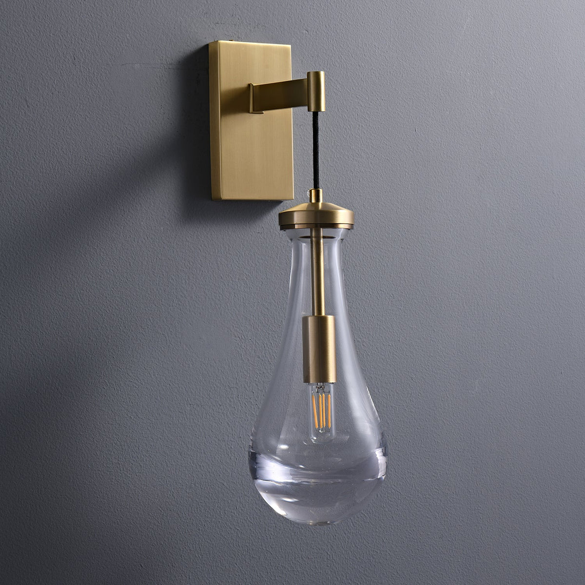 Leontine Brass Glass Teardrop Wall Sconce for Modern Interiors