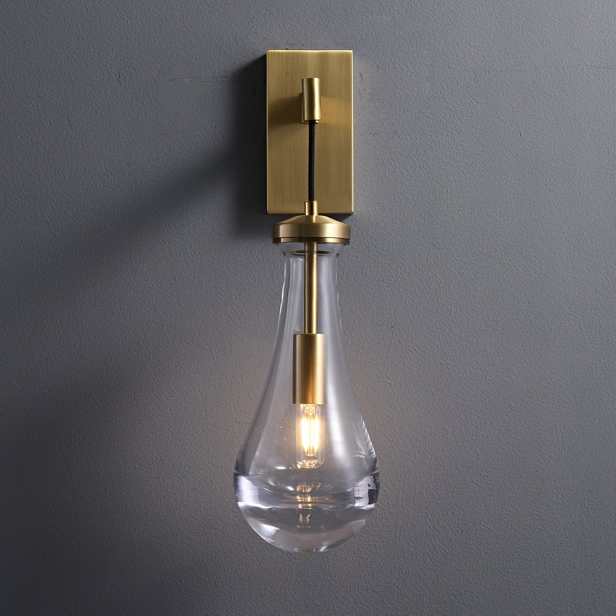 Leontine Brass Glass Teardrop Wall Sconce for Modern Interiors