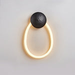 Loop Wall Sconce in Natural Travertine with Braided LED Light