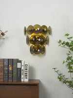 Loren Wall Sconce with Handcrafted Glass Discs in Brass or Gunmetal