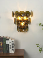 Loren Wall Sconce with Handcrafted Glass Discs in Brass or Gunmetal