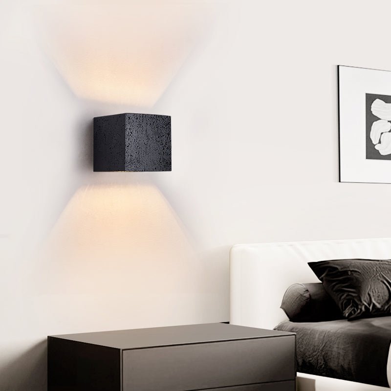 Lumina Void Sconce — Black Travertine Wall Light with Warm Glow