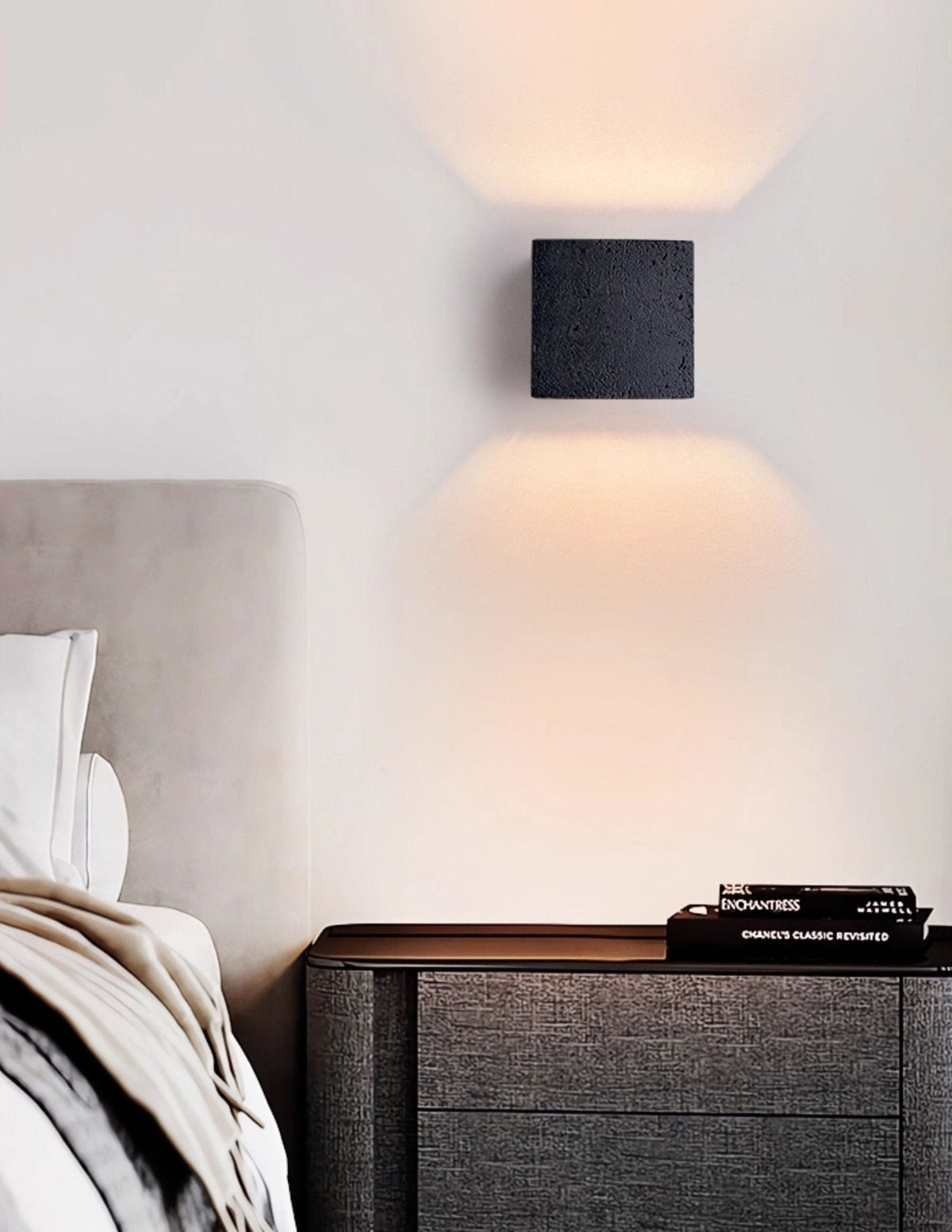 Lumina Void Sconce — Black Travertine Wall Light with Warm Glow