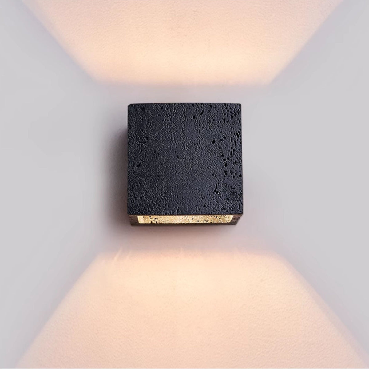 Lumina Void Sconce — Black Travertine Wall Light with Warm Glow