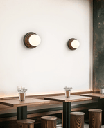 Lunara Black Travertine Wall Sconce with Opal Glass Globe