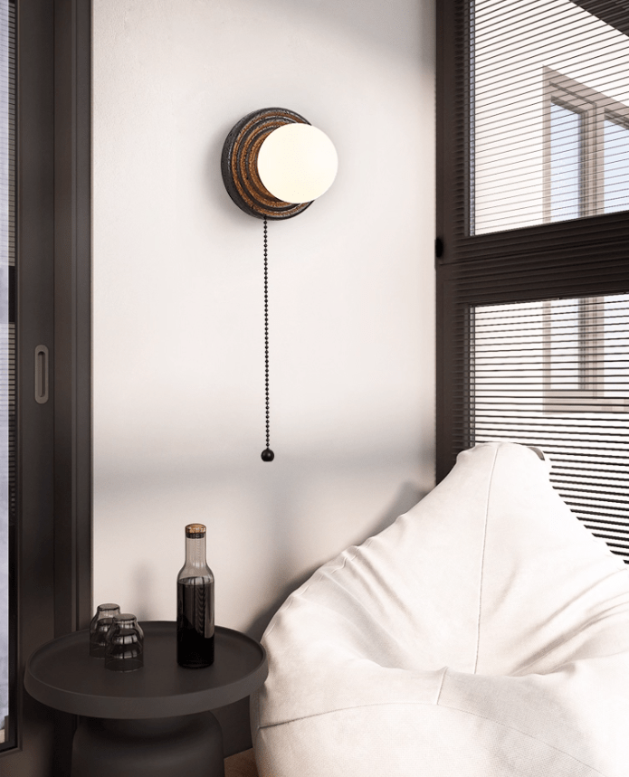 Lunara Black Travertine Wall Sconce with Opal Glass Globe