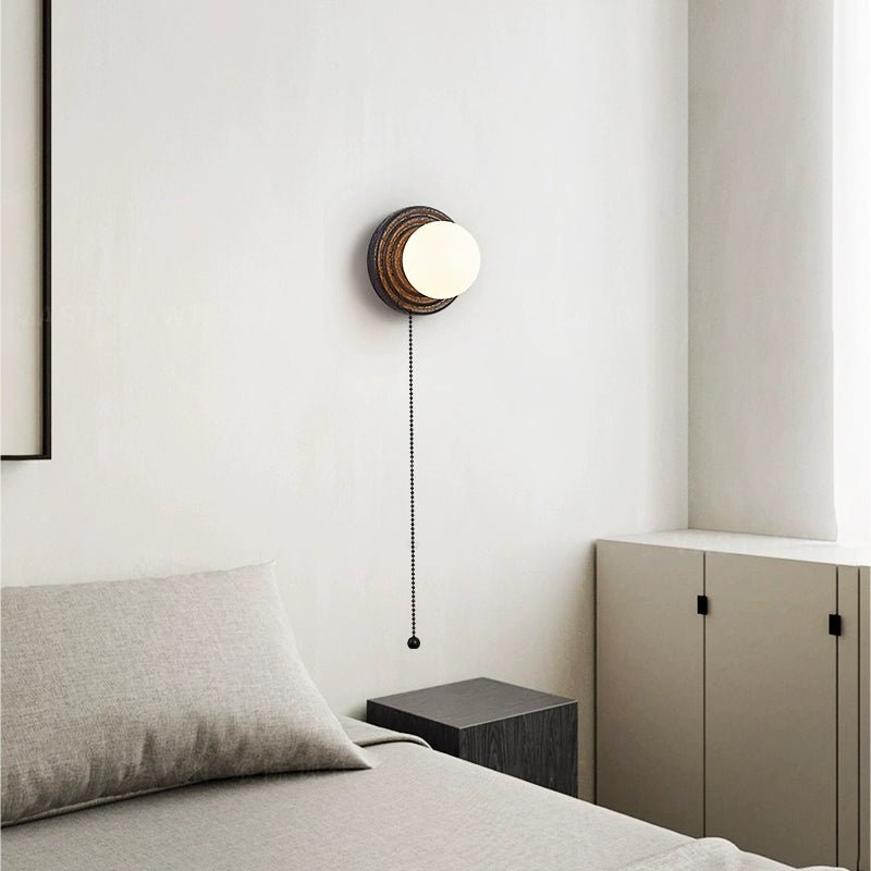 Lunara Black Travertine Wall Sconce with Opal Glass Globe