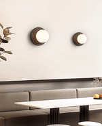 Lunara Black Travertine Wall Sconce with Opal Glass Globe