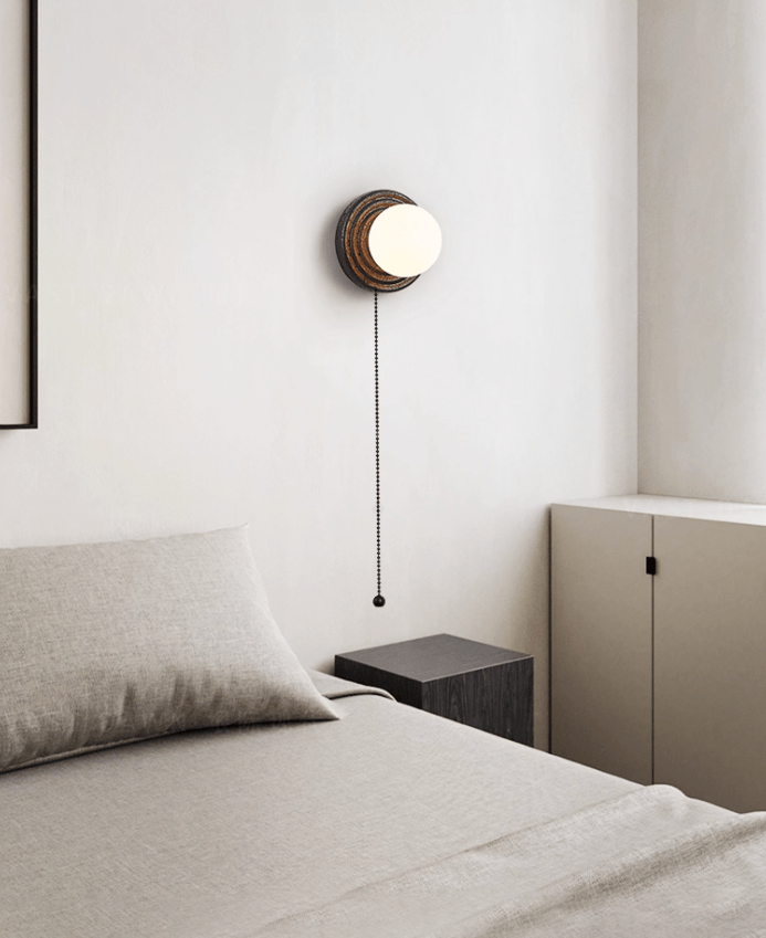 Lunara Black Travertine Wall Sconce with Opal Glass Globe