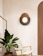 Lunar Embrace Wall Sconce — Black Travertine & Walnut with Opal Glass Globe