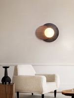 Lunar Embrace Wall Sconce — Black Travertine & Walnut with Opal Glass Globe