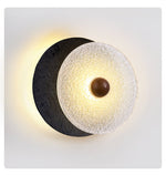Lunara Textured Disc Wall Sconce in Black Travertine and Frosted Glass