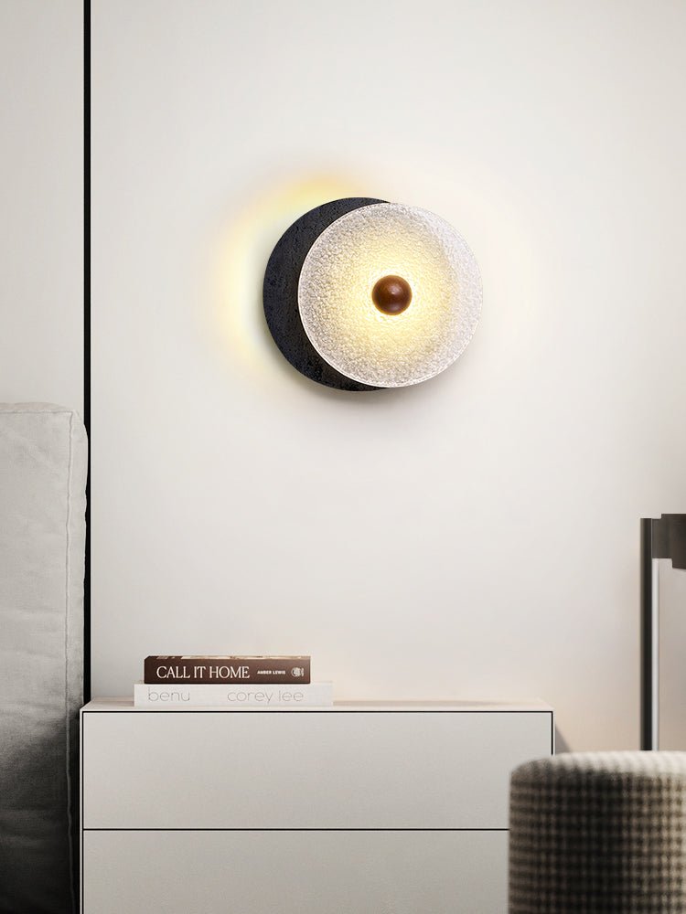 Lunara Textured Disc Wall Sconce in Black Travertine and Frosted Glass