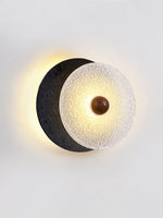 Lunara Textured Disc Wall Sconce in Black Travertine and Frosted Glass