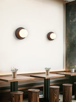 Lunara Black Travertine Wall Sconce with Opal Glass Globe