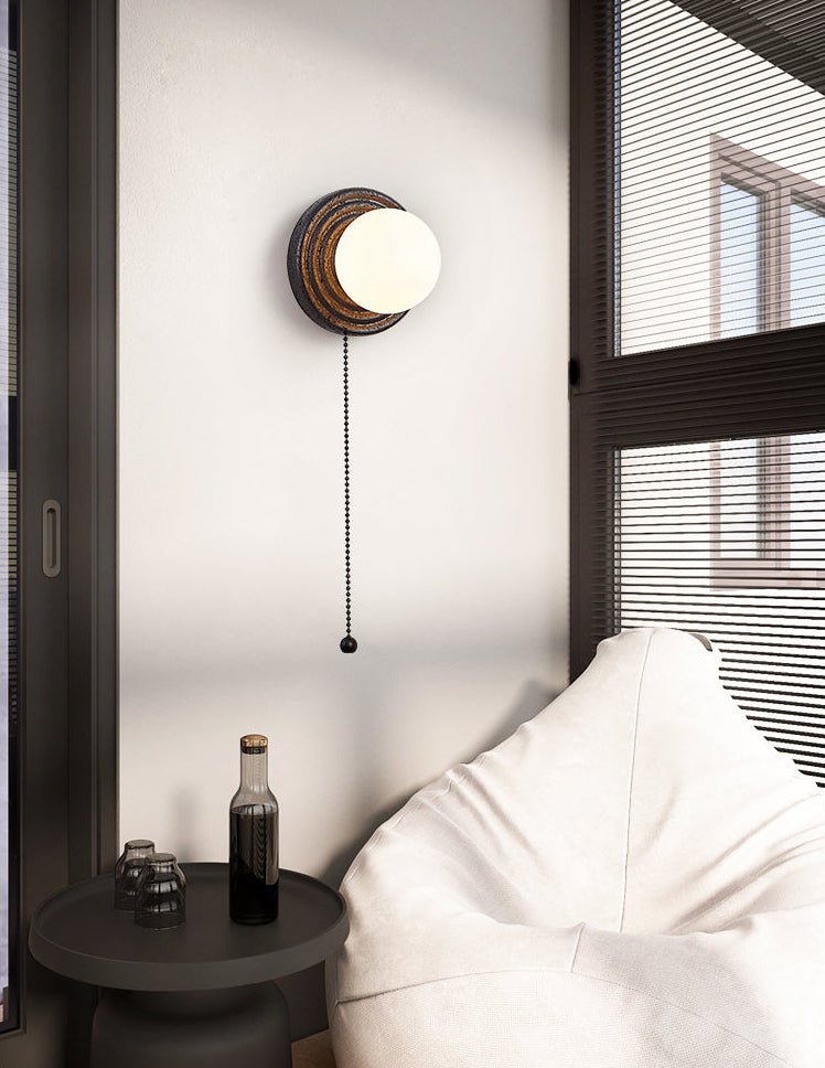Lunara Black Travertine Wall Sconce with Opal Glass Globe