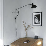 mantis-arm-wall-lamp
