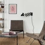Maxon Adjustable Swing Arm Wall Sconce in Glossy Black for Modern Interiors