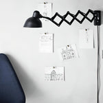 Maxon Adjustable Swing Arm Wall Sconce in Glossy Black for Modern Interiors