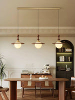Orben Globe Pendant Light in Gold and Walnut with Opal Glass Shade