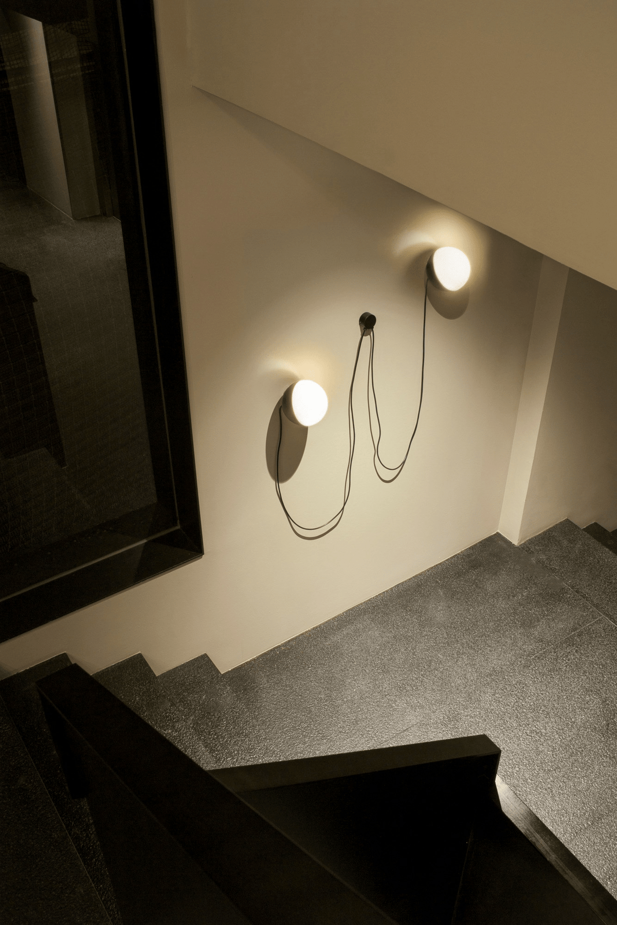 Orbit Dual Globe Wall Sconce in Opal Glass and Black Metal