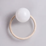Orria Travertine Wall Sconce with Opaline Glass Globe